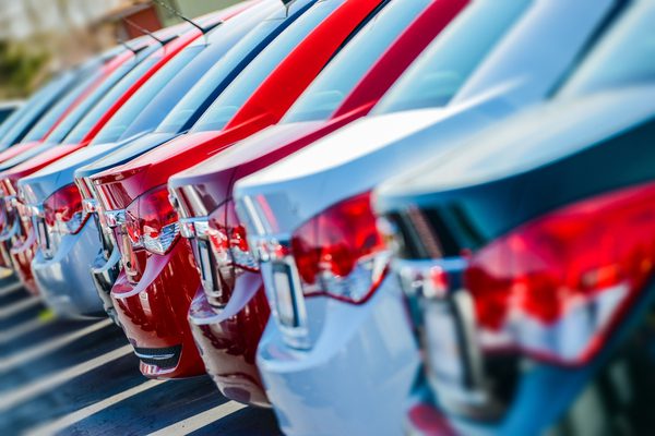 leasing vs. buying a car dealership lot