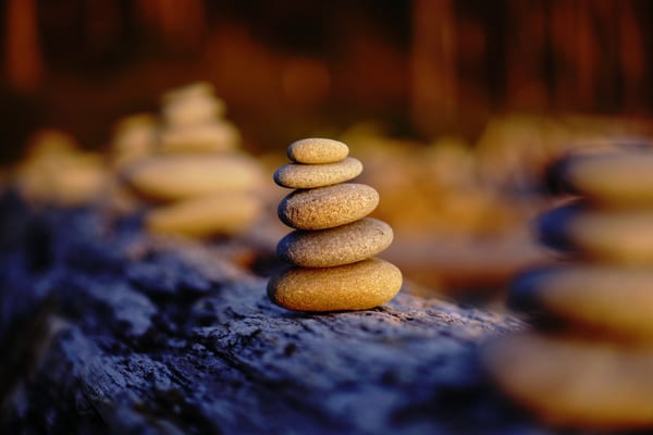 mindfulness in messy times rock pile on beach