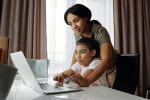 family philanthropy mom and daughter on the computer