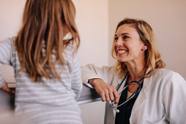 wellbeing for doctors female physician meeting with kid patient