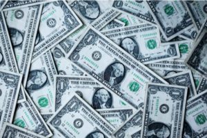 retirement withdrawals pile of dollar bills money
