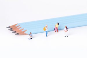 students going to school stack of pencils budgeting and investing for young adults