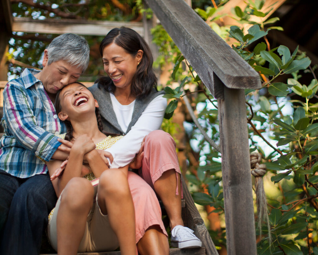 Smiling multi generational family sitting together.