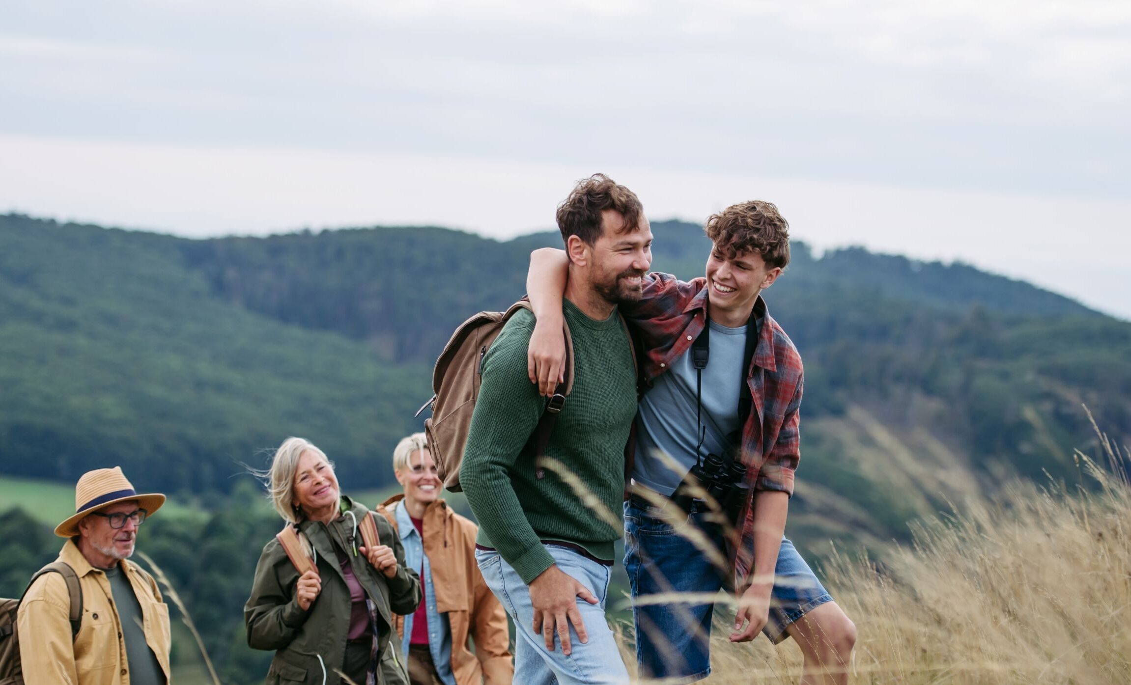 Family-on-a-hill-e1770229844953-aspect-ratio-990-600